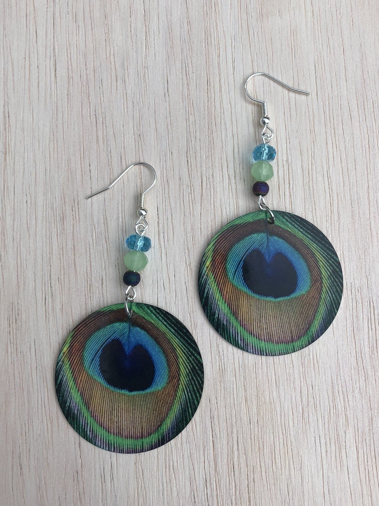 peacock feather round Dangle Earrings with a glass beads. A Unique gift idea