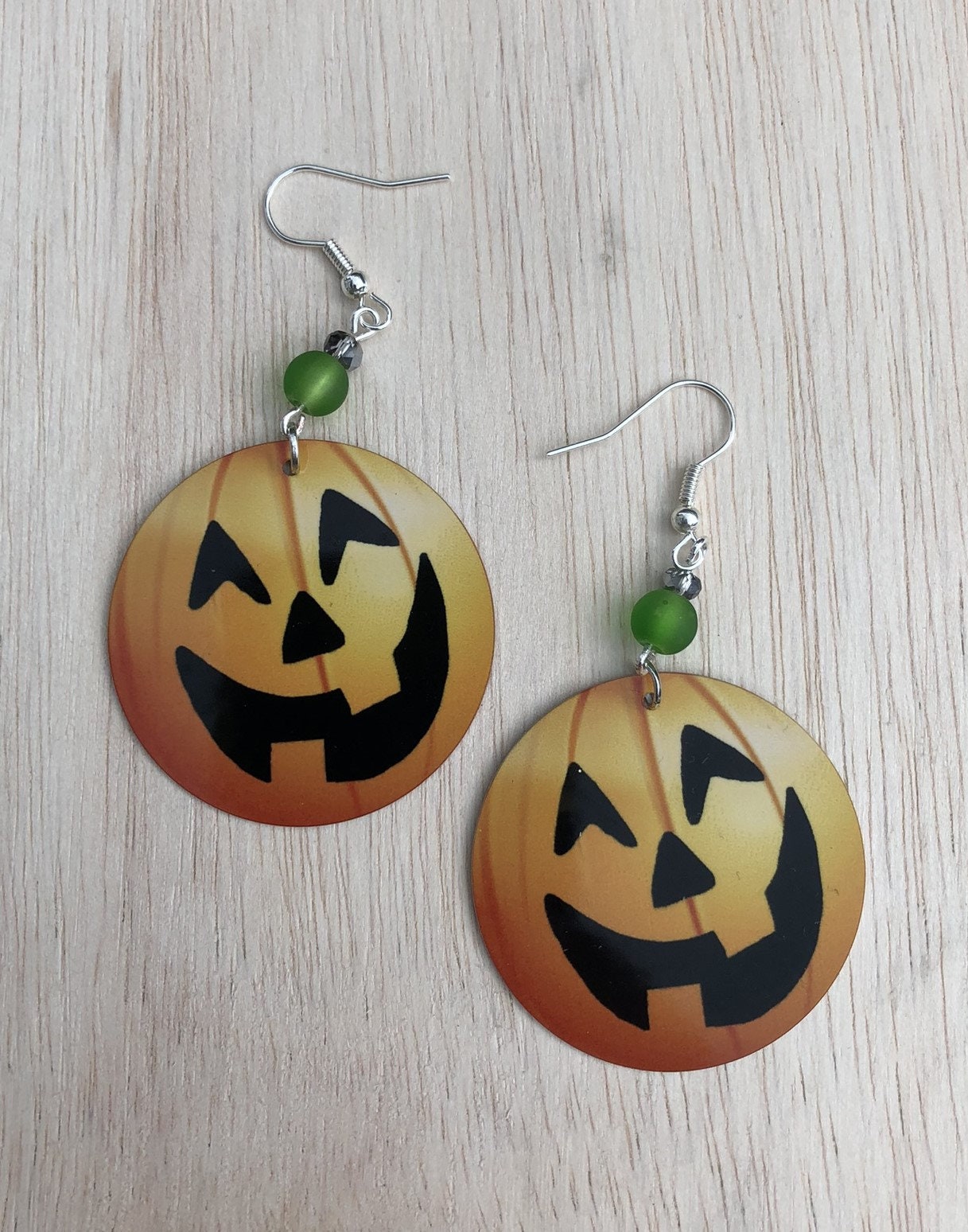 Pumpkin face round Dangle Earrings with a glass beads. A Unique gift idea for halloween